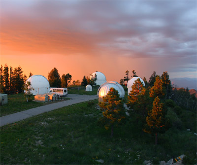 Photo of Mount Lemmon SkyCenter with sunset behind it 