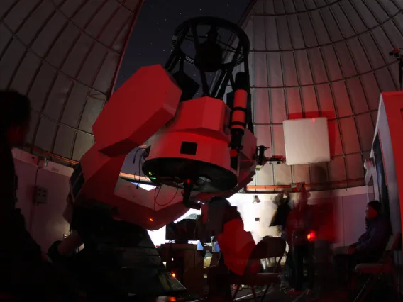 Picture of students using telescope